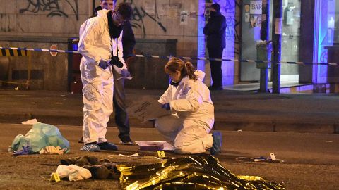 Forensics experts gather around the body of Berlin atttack suspect Anis Amri on Friday in Milan. 