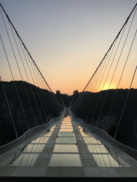 Haim Dotan's $3.4 million glass bridge is a staggering structure by any measure. But it's not meant to steal the show. It was designed to be an invisible "white bridge disappearing into the clouds," according to a statement.