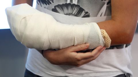 Kvitova holds her bandaged hand after addressing media in Prague.