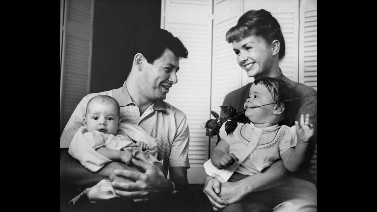 Fisher is photographed with her parents and brother, Todd, who was born in 1958. 