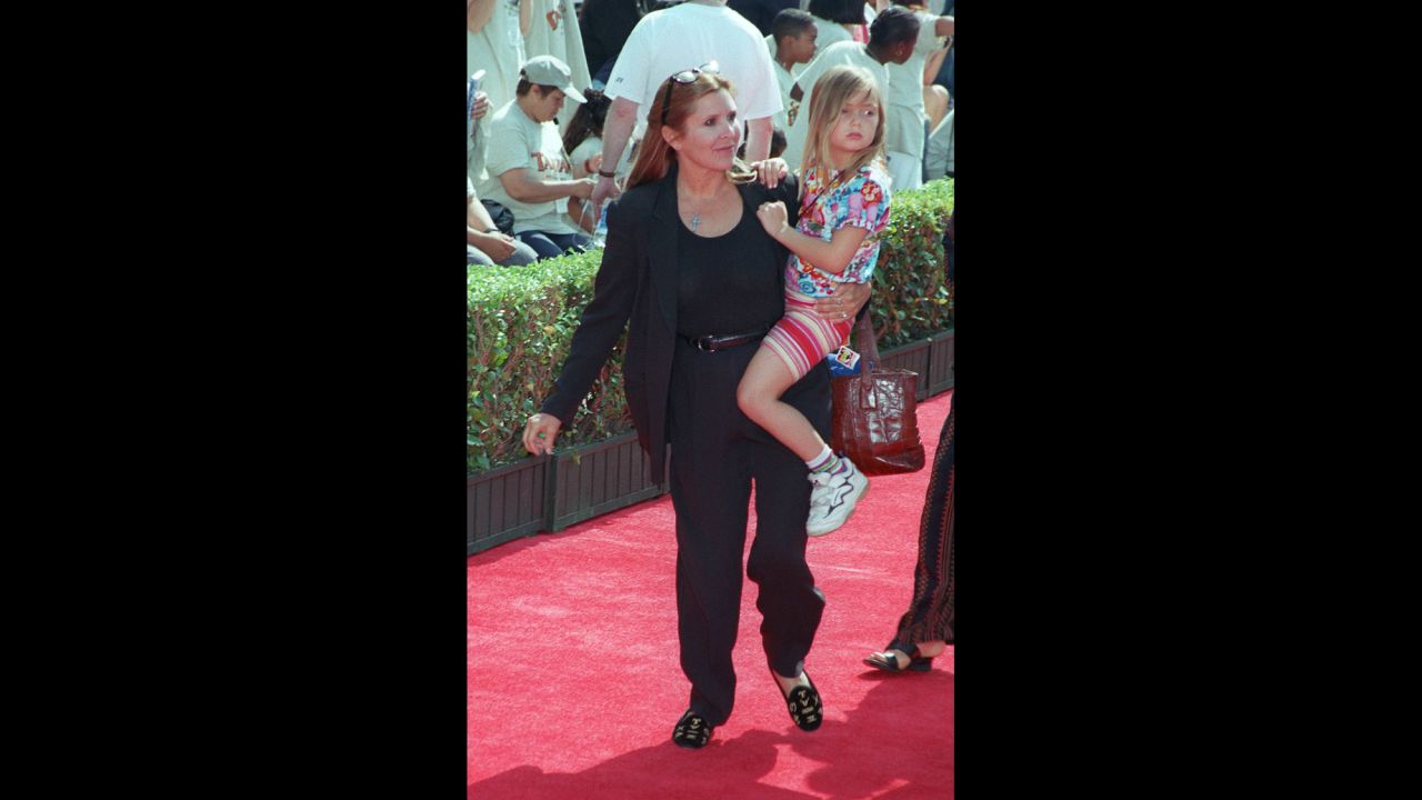 Fisher carries Billie Catherine Lourd -- her daughter with talent agent Bryan Lourd.
