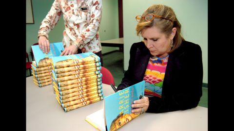 Fisher attends a book signing for her novel, "The Best Awful," in Beverly Hills, California, in 2004. The semi-autobiographical novel fictionalized events from Fisher's life. 