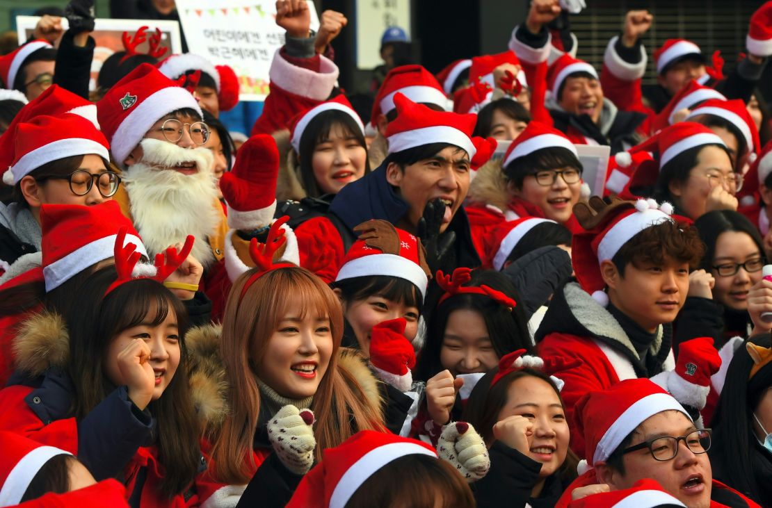 South Koreans don holiday attire at Saturday's rally in the ninth straight weekend of protests.