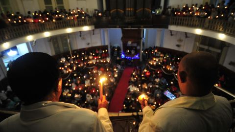 Christians in Indonesia hold candles at church services in Jakarta on December 24.