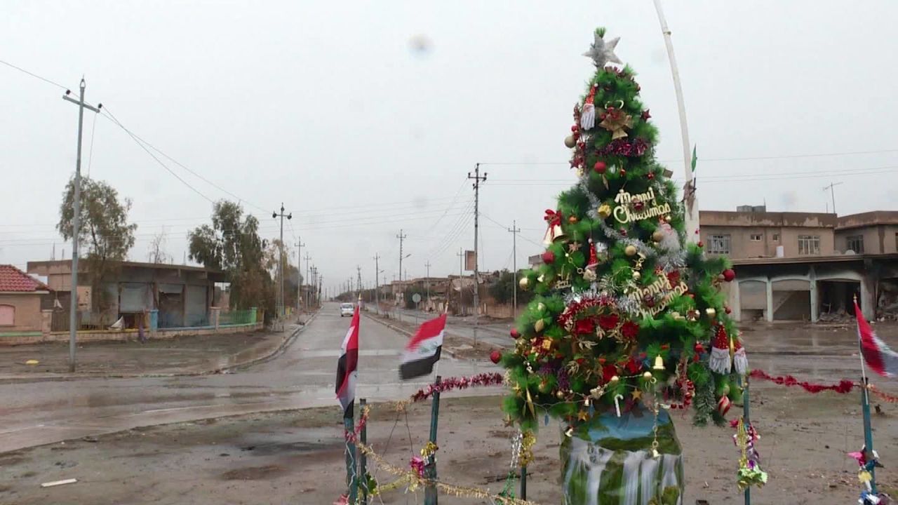 A plastic tree outside the Mart Shmony Church marks the return of Christmas to battle-scarred Bartella.