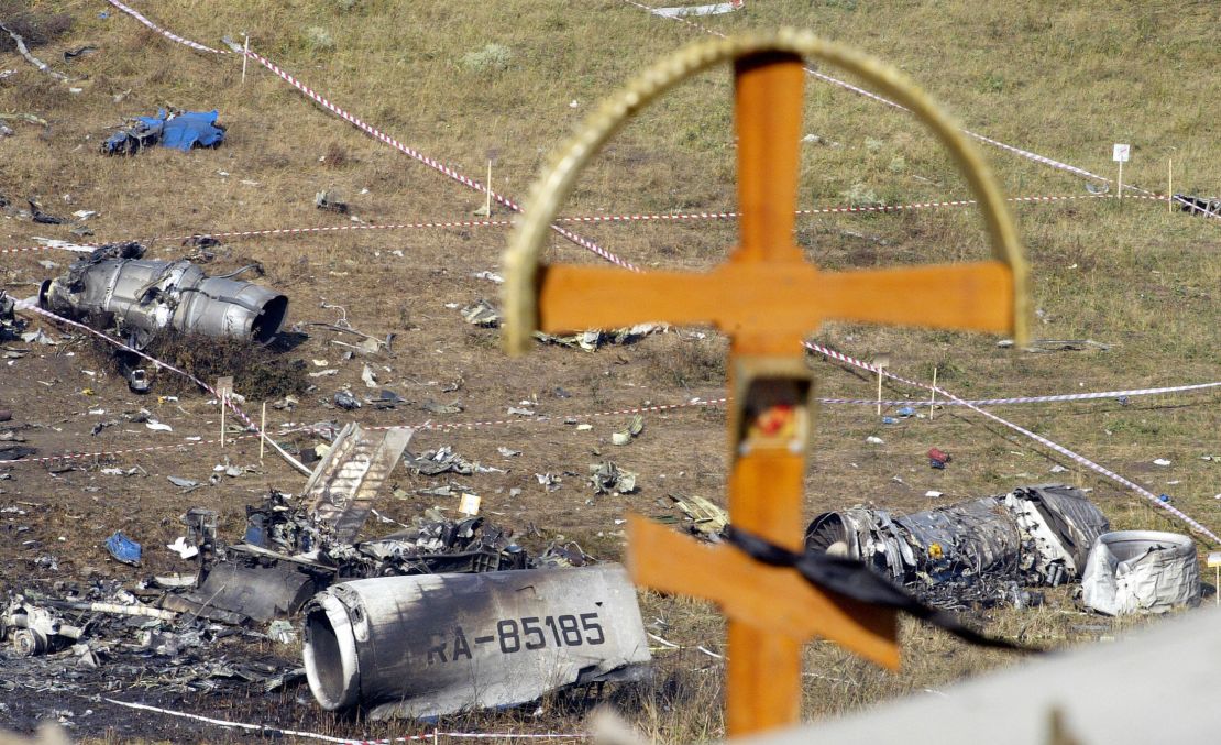 A cross is seen over the debris at the crash site the Russian Tupolev Tu-154 plane in Sukha Balka, 40kms from Ukrainian city of Donetsk/