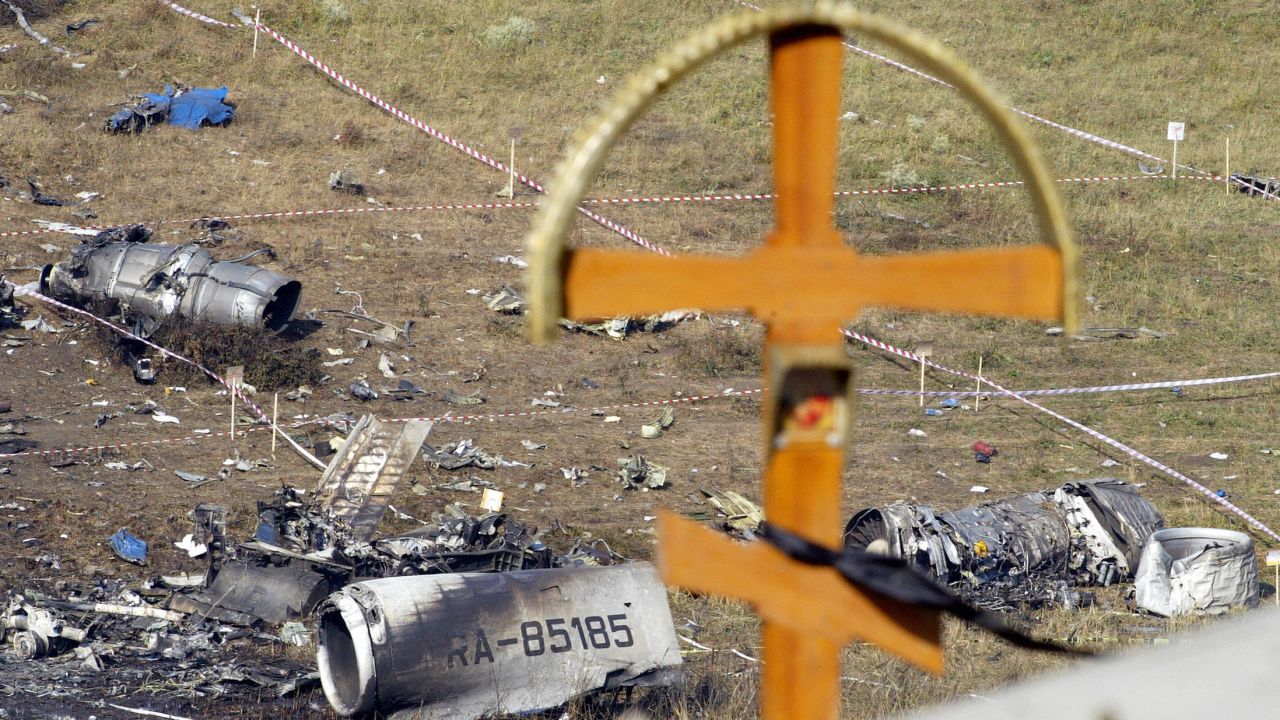 A cross is seen over the debris at the crash site the Russian Tupolev Tu-154 plane in Sukha Balka, 40kms from Ukrainian city of Donetsk/