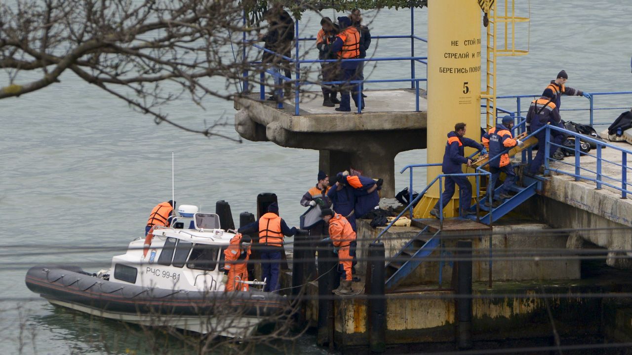 Russian emergency personnel work near the site of the crash on December 25. The plane was en route from Moscow to Syria and had stopped in Sochi to refuel.