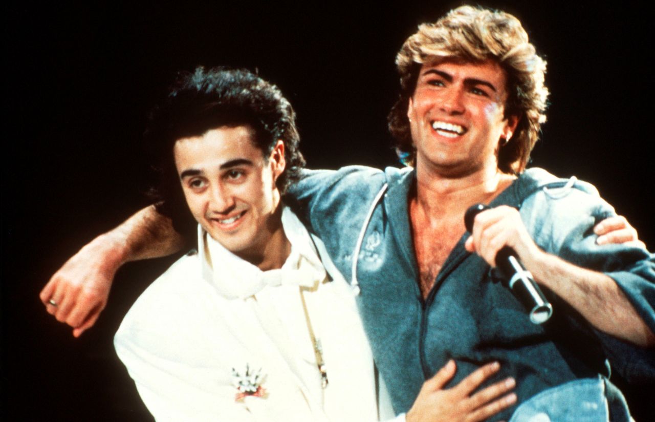 Andrew Ridgeley and George Michael of Wham! perform on stage in 1985. The duo met at Bushey Meads School, in 1976, according to Michael's website.