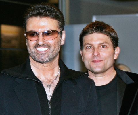 George Michael, left, with his partner Kenny Goss at a reception after the Japan premiere of his autobiographical movie "George Michael: A Different Story," in December 2005. In 1998, Michael told CNN in an exclusive interview that he was gay.