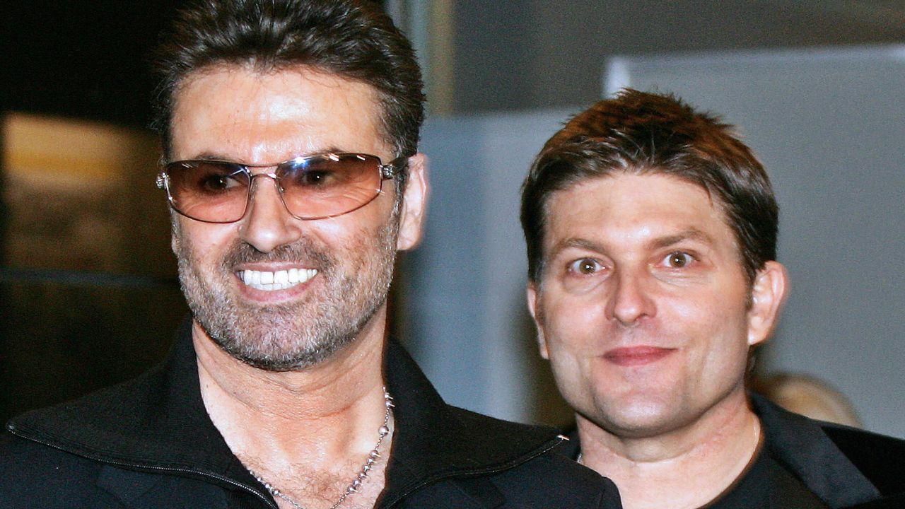 The late British pop star George Michael (left) with his then-partner Kenny Goss in 2005.