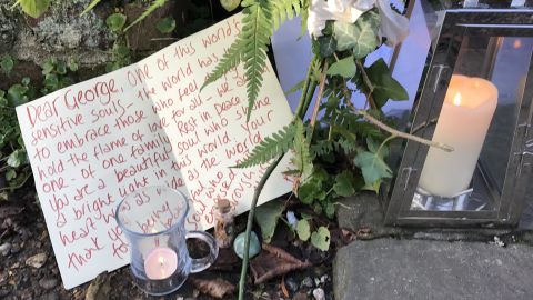 Flowers and letters have ben left by those visiting Michael's home.