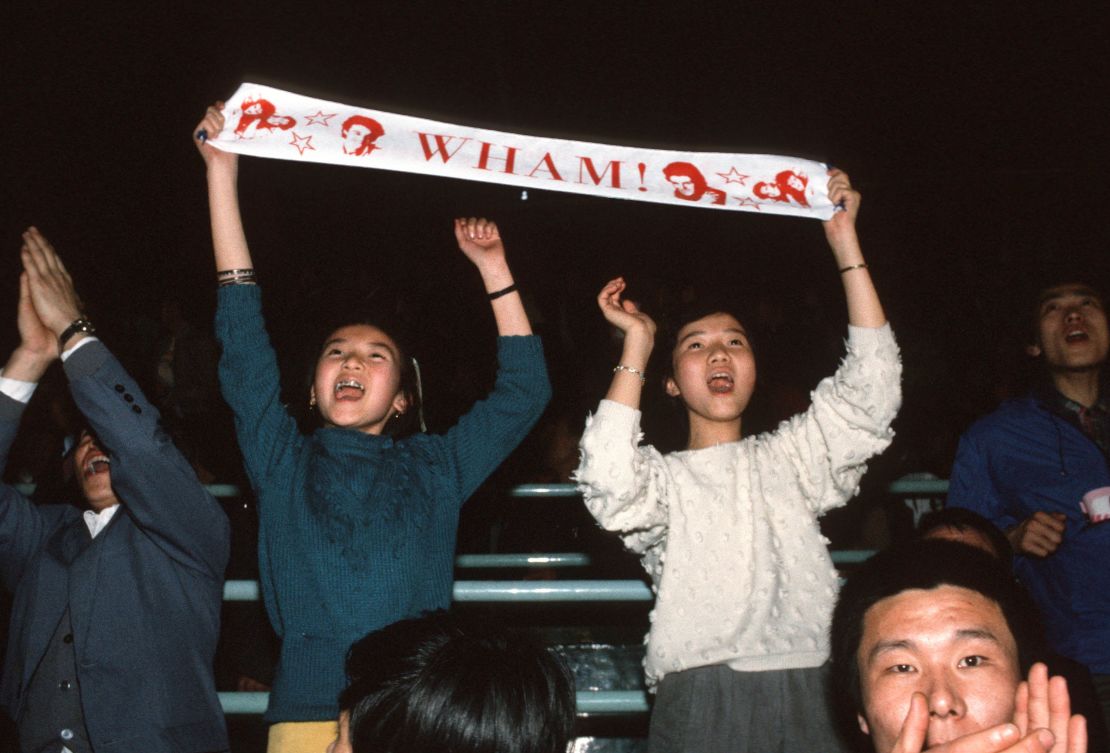 Fans of Wham! enjoy the concert in Beijing.