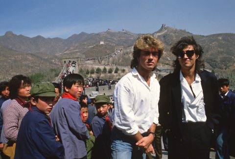 Michael and Ridgeley pose for a photo at the Great Wall of China in 1985, during Wham!'s historic visit as the first-ever Western pop band to perform in the communist country.