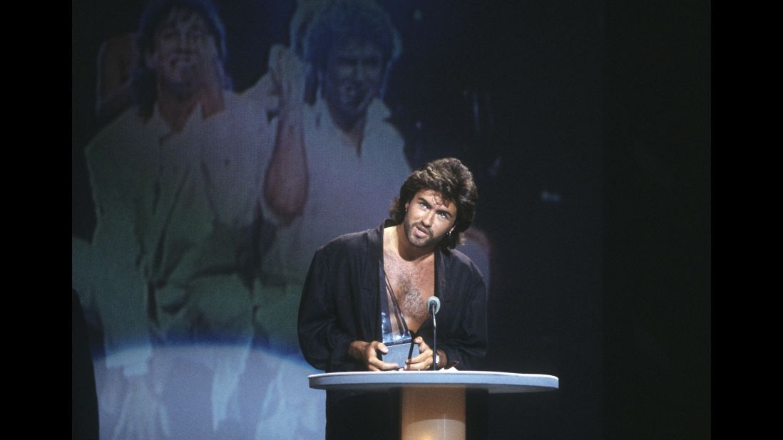 Michael accepts Wham!'s award for favorite pop/rock band group at the American Music Awards in January 1986.