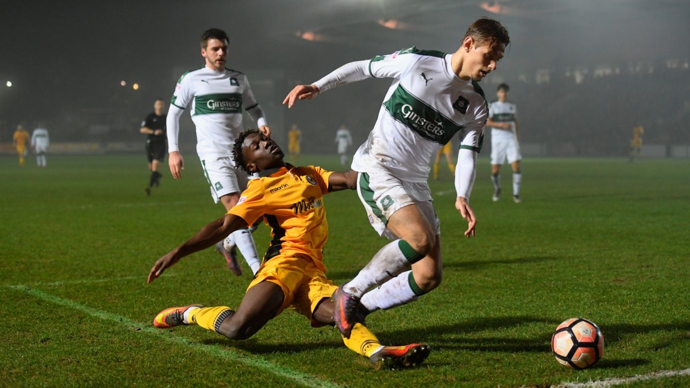 Newport's Jordan Green loses the ball to Plymouth's Oscar Threlkeld during an FA Cup second round replay match in Newport, Wales, on Wednesday. Plymouth won 1-0.