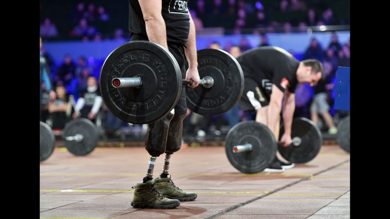 Competitors lift weights in the "Games of the Heroes" final competition during the CrossFit Games in Kiev, Ukraine, on Saturday. Some 15 Ukrainian servicemen who became disabled during the fighting with pro-Russian separatists took part in the competition.