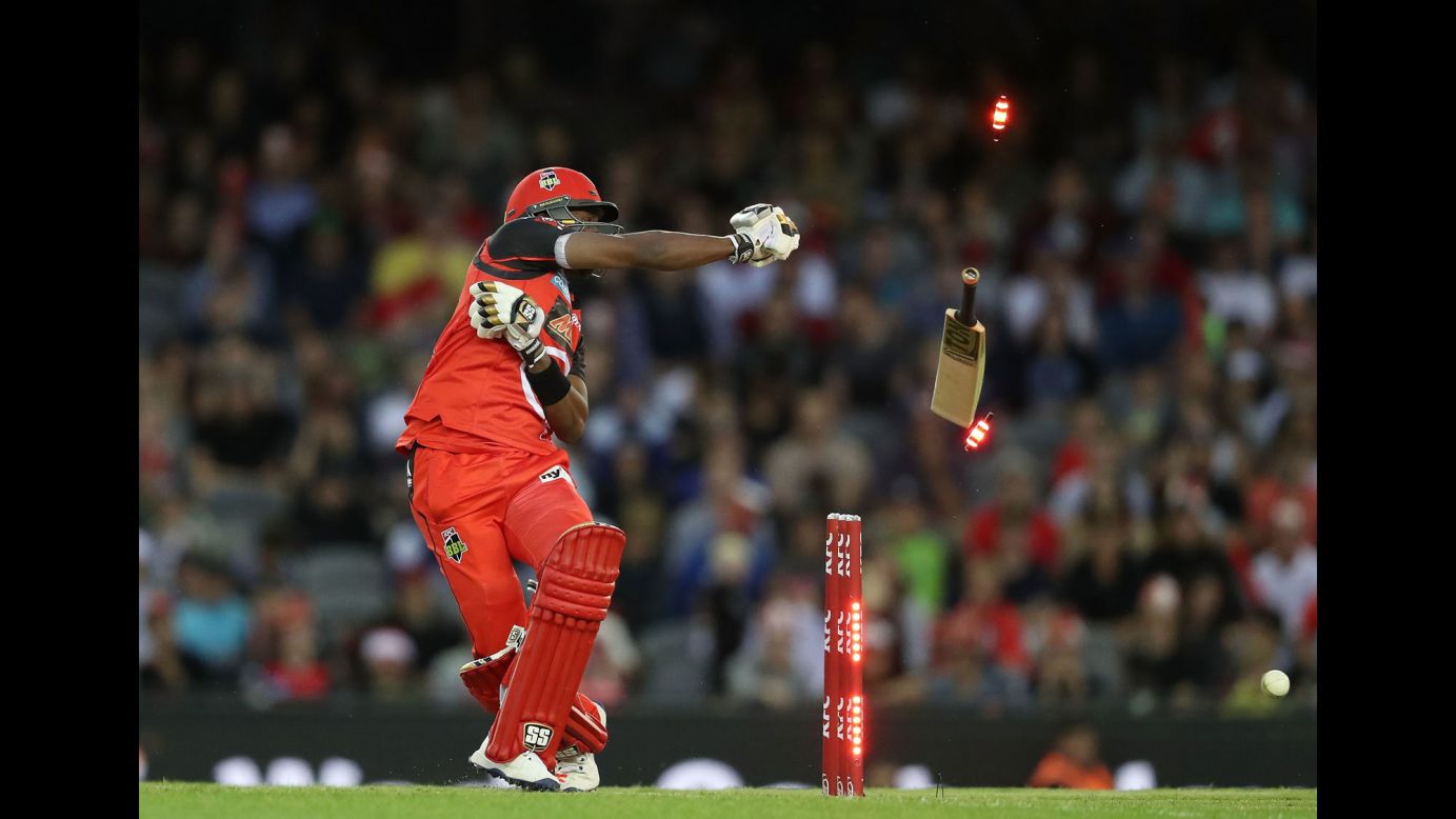 Melbourne's Dwayne Bravo loses grip of his bat as he is bowled out during a Big Bash League cricket match against Sydney in Melbourne, Australia, on Thursday.