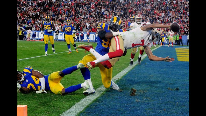 San Francisco quarterback Colin Kaepernick dives for the two-point conversion to give his team the lead over Los Angeles during an NFL game in Los Angeles on Saturday. San Francisco won 22-21.