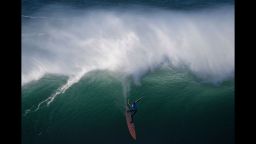 TOPSHOT - American big wave surfer Nic Lamb drops a wave off Praia do Norte in Nazare  during the first edition of the World Surf League's Nazare Challenge on December 20, 2016. / AFP / FRANCISCO LEONG        (Photo credit should read FRANCISCO LEONG/AFP/Getty Images)