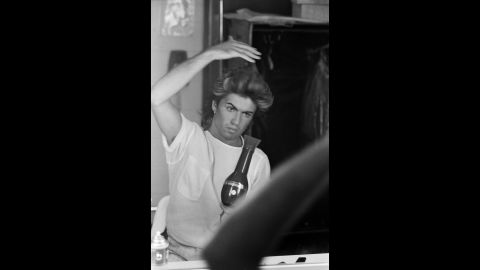 Michael blow-dries his hair while on Wham!'s 1985 world tour. The band made stops in the UK, Japan, Australia, and China.