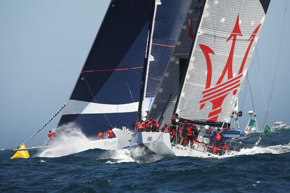 The fourth supermaxi in the fleet was CQS -- formerly the 90-foot Nicorette rebuilt in New Zealand for Finnish owner Ludde Ingvall, a two-time line honors winner of the race. It finished seventh. Here CQS (left) heads out to sea with the 70-foot Maserati, which crossed sixth as both boats were becalmed for hours in the Derwent River when the wind died.