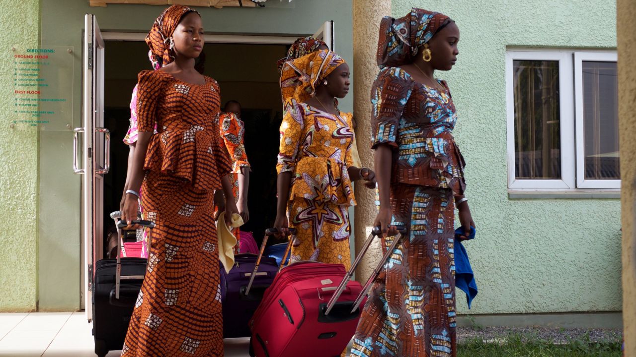 The girls leave accommodations in Abuja on Friday en route to the airport to begin the six-hour journey home to Chibok after being held captive by Boko Haram militants for nearly three years.<br /> <br />