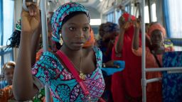 The girls ride the bus in Abuja en route to Chibok to reunite with their families.