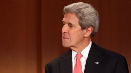 Secretary of State John Kerry listens while receiving the Federal Cross of Merit (Bundesverdienstkreuz) award on December 5, 2016 in Berlin, Germany. 