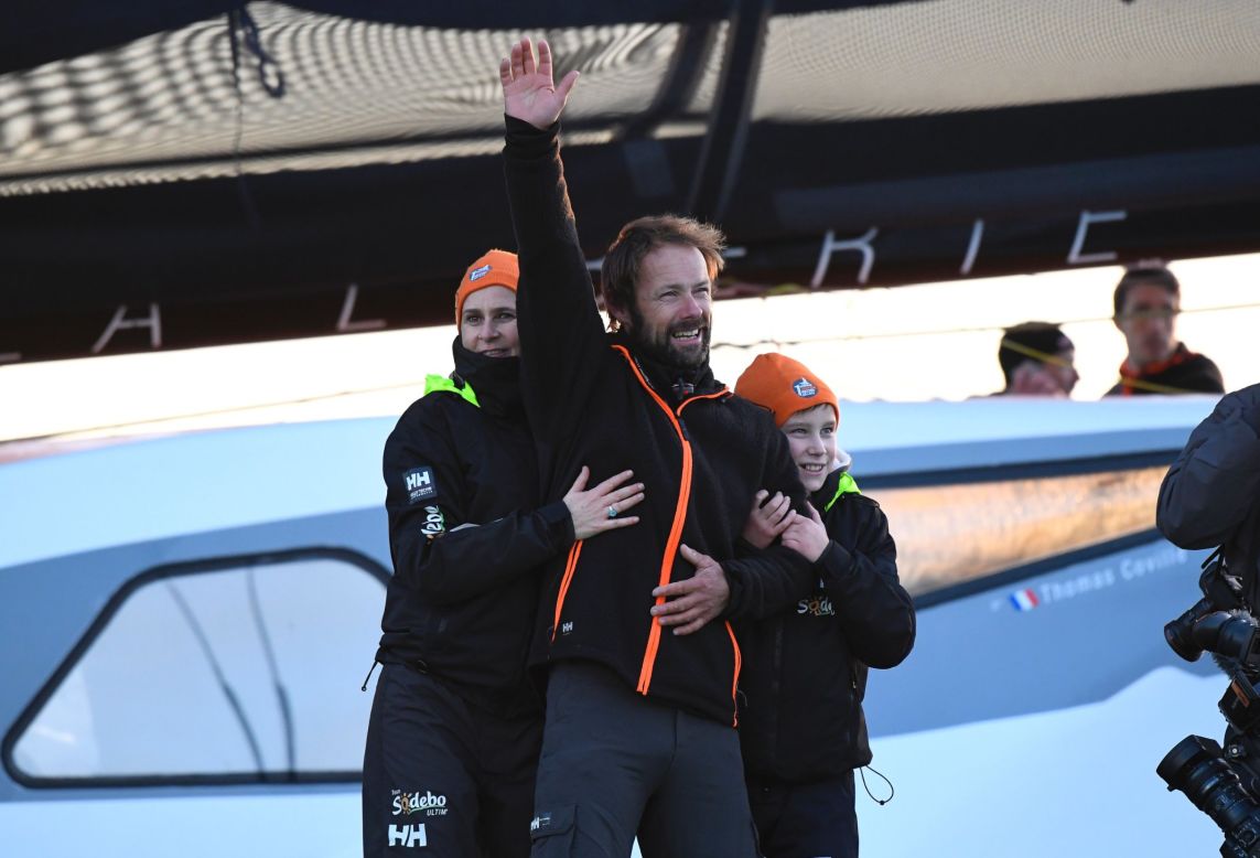 Coville spent Sunday night on board alone after completing the feat, but was joined for his arrival in the port by wife Cathy (L) and son Eliott (R).