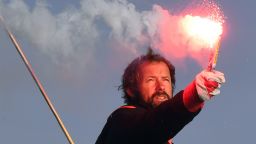 French skipper Thomas Coville holds a burning flare onboard his "Sodebo Ultim'" multihull as he arrives in the port of Brest, western France, on December 26, 2016, after beating the record in solo non-stop round the world sailing.
Coville, 48, slashed eight days off the record when he ended an astonishing solo non-stop circumnavigation of the World on his 31m maxi trimaran on December 25, 2016, in just 49 days, 3 hours, 7mins and 38secs.
 / AFP / Damien MEYER        (Photo credit should read DAMIEN MEYER/AFP/Getty Images)