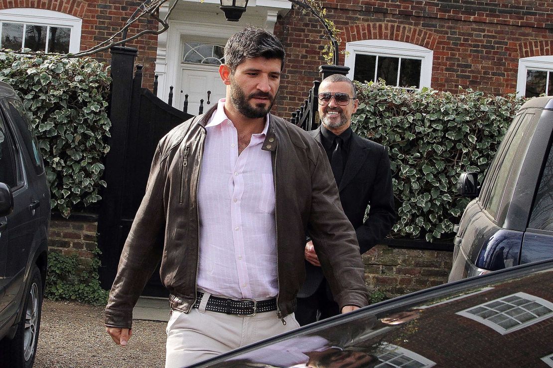 George Michael (right) and Fadi Fawaz outside their London home in 2012.