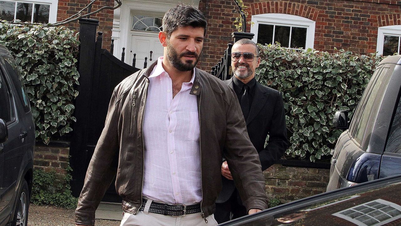 George Michael (right) and Fadi Fawaz outside their London home in 2012.
