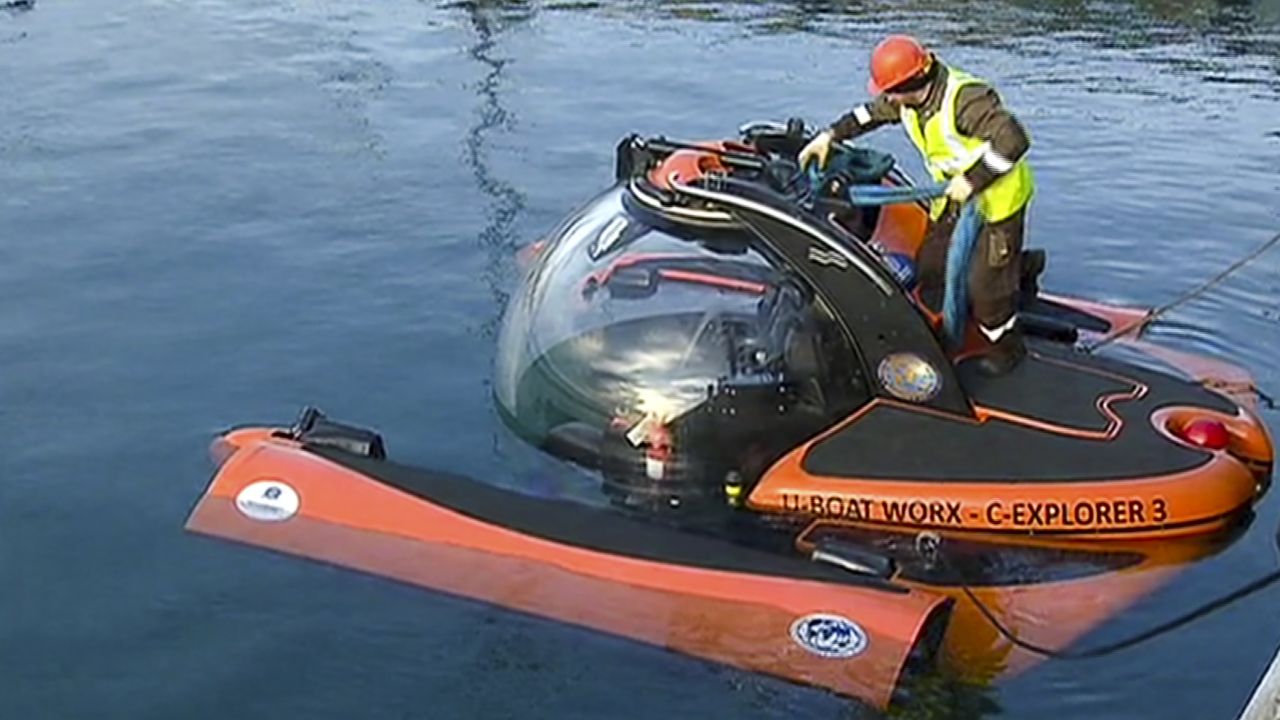 Emergency Ministry personnel prepare a submersible craft Tuesday to search for sunken wreckage and victims' remains. Thirteen bodies had been recovered from the Black Sea as of Tuesday morning.
