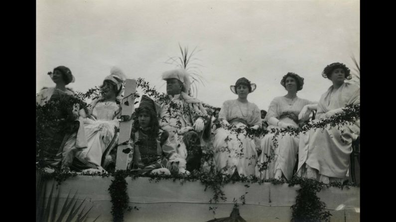 The king and queen, Dr. Fitch C. E. Mattison, fourth from left, and Miss Mabel Seibert, third from left, ride with the other members of the Rose Court in 1914. 