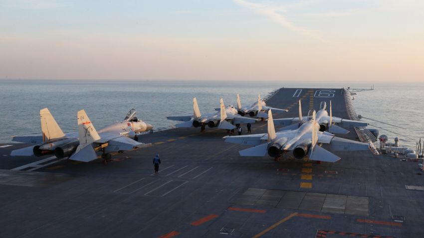 This picture taken on an undisclosed date in December 2016 shows Chinese J-15 fighter jets waiting on the deck of the Liaoning aircraft carrier during military drills in the Bohai Sea, off China's northeast coast. 
China's Liaoning aircraft carrier battle group has conducted its first exercises with live ammunition, the country's navy said, in a show of strength as tensions with the US and Taiwan escalate. China's first and only aircraft carrier led large-scale exercises in the Bohai Sea, the People's Liberation Army Navy said late on December 15, 2016 in a statement on their website. / AFP / STR / China OUT        (Photo credit should read STR/AFP/Getty Images)