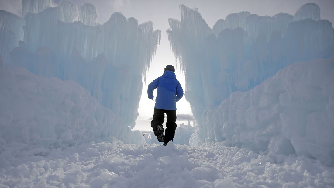 A worker walks through the Ice Castles in Midway, Utah. The public can now tour the complex, which is made of hundreds of thousands of icicles.