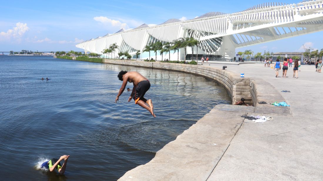 As Rio de Janeiro temperatures reached 100 degrees Fahrenheit (43.4 degrees Celsius) on December 26, children jumped into the polluted waters of Guanabara Bay to cool off.