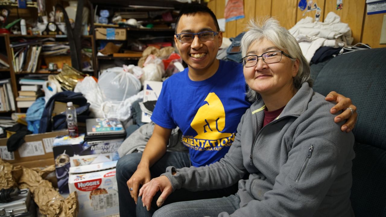 Esau Sinnok and his adoptive mother, Bessi Sinnok, reluctantly say they want the village to move. The younger Sinnok says it's the only way to preserve the community's unique indigenous traditions. Climate change will force relocation if locals don't plan it, he said.