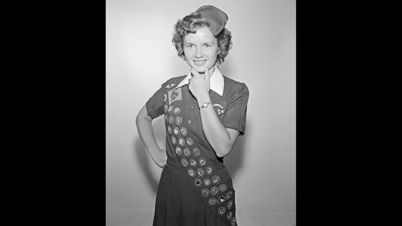 Reynolds was a proud member of the Girl Scouts. At the time of this photo, at age 17, she had earned 42 out of a possible 100 badges in eight years of scouting.