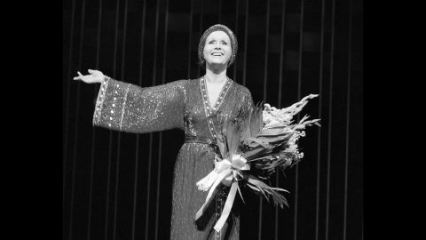 Reynolds on stage for for a curtain call after a performance of "Woman of the Year" at New York's Palace Theatre in 1983.