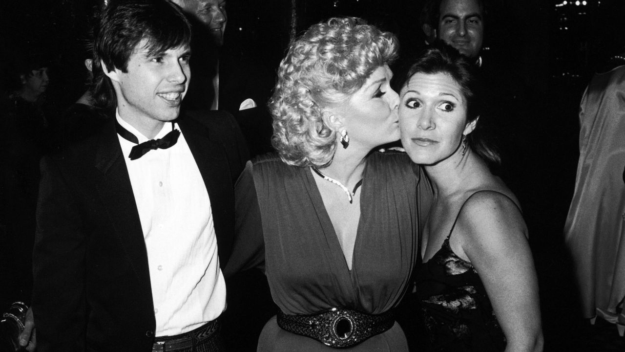 Reynolds with Todd and Carrie Fisher at the Thalians Ball in 1985. Reynolds was involved with the Thalians, a group of entertainment professionals who support mental health issues, from the 1950s. 