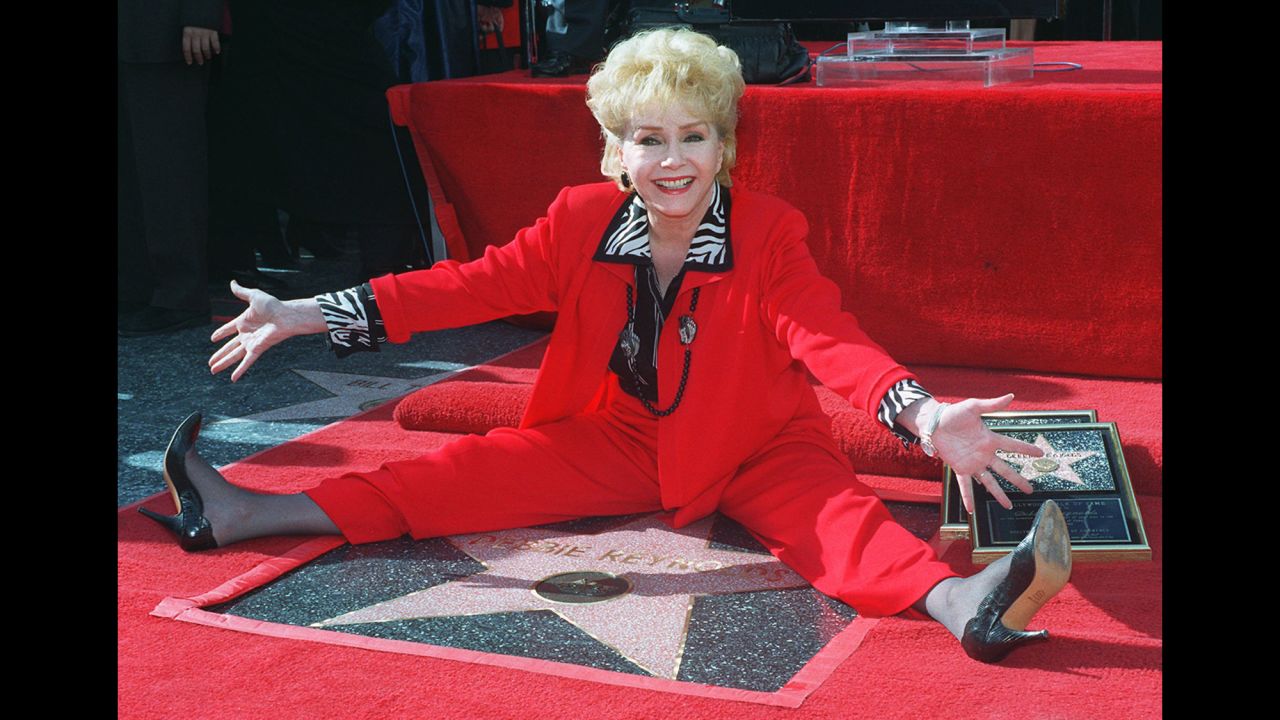 Reynolds poses with her second star on the Hollywood Walk of Fame on January 13, 1997.