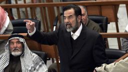 Former Iraqi president Saddam Hussein chastises the court moments after his half brother, Barzan Ibrahim al-Tikriti, was forcibly removed from their trial held in Baghdad's heavily fortified Green Zone, 29 January, 2006.