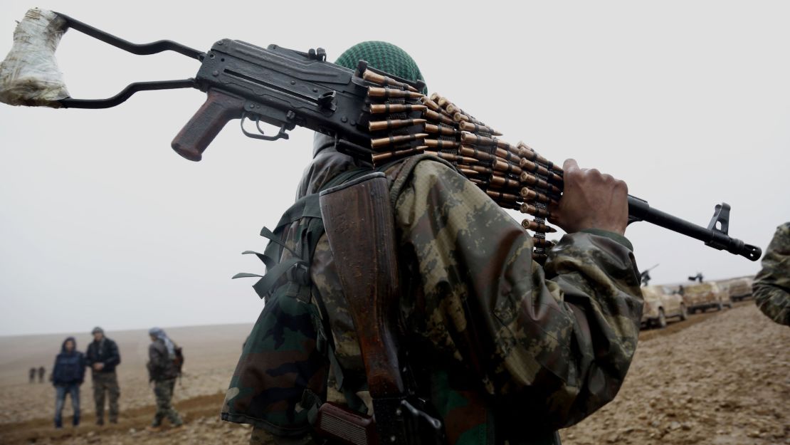 A fighter from the Syrian Democratic Forces advancng on an ISIS position near Raqqa, Syria.