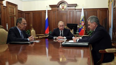 Russian President Vladimir Putin, center, speaks with Foreign Minister Sergey Lavrov, left, and Defence Minister Sergei Shoigu in Moscow on Thursday.