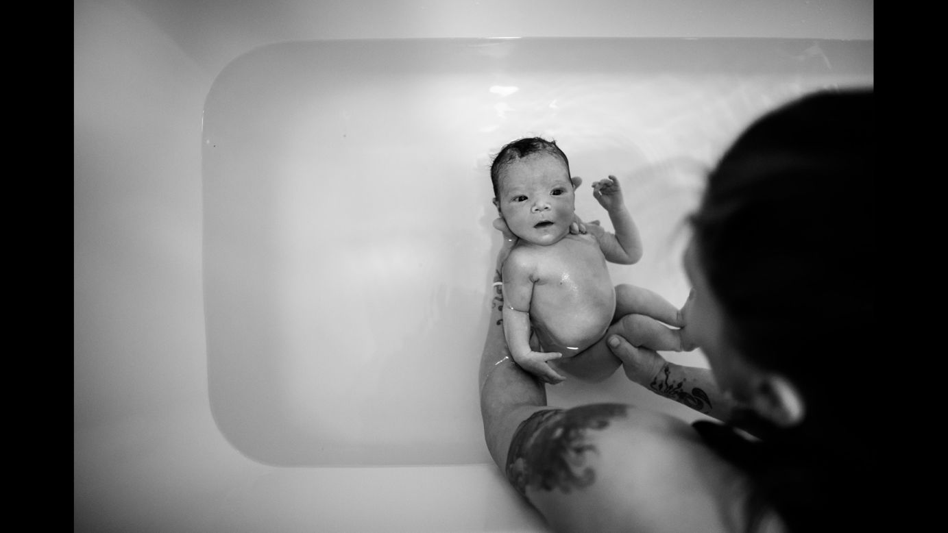 Allison bathes Sky for the first time, six days after her birth.
