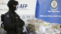 A police officer guards a haul of drugs that are on display at an Australian Federal Police office in Sydney, Australia, Thursday, Dec. 29, 2016. Officials have seized more than a ton of cocaine worth about 360 million Australian dollars ($260 million) in what police have dubbed one of the largest drug busts in the nation's history. (AP Photo/Rick Rycroft)