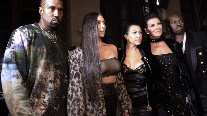 (From L) Kanye West, Kim Kardashian, Kourtney Kardashian, Kris Jenner and Corey Gamble attend the Off-white 2017 Spring/Summer ready-to-wear collection fashion show, on September 29, 2016 in Paris. / AFP / ALAIN JOCARD        (Photo credit should read ALAIN JOCARD/AFP/Getty Images)