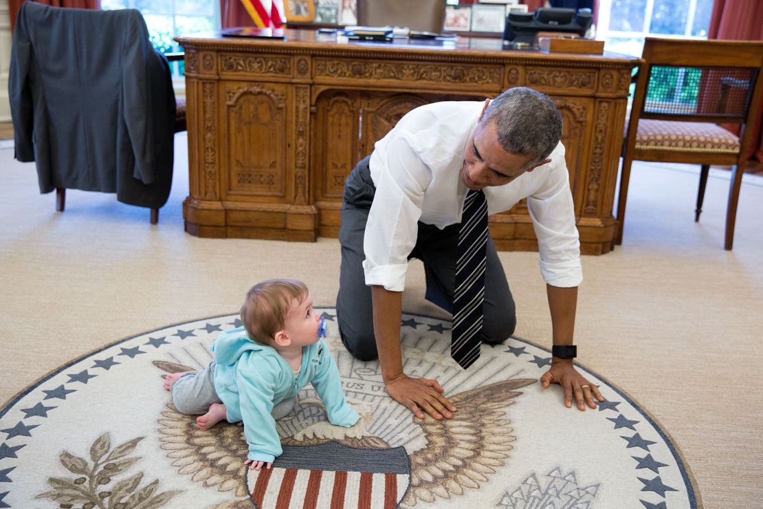 "The President is always asking staff to bring their babies and young kids by for a visit. Here, during a break between meetings one afternoon, the President crawled around in the Oval Office with Communications Director Jen Psaki's daughter Vivi." (Official White House Photo by Pete Souza)